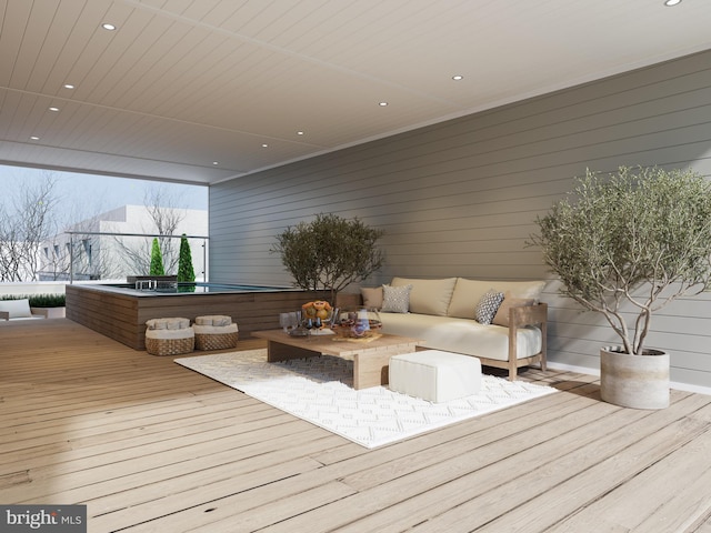 wooden deck with an outdoor living space