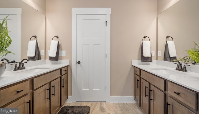 bathroom with oversized vanity and double sink