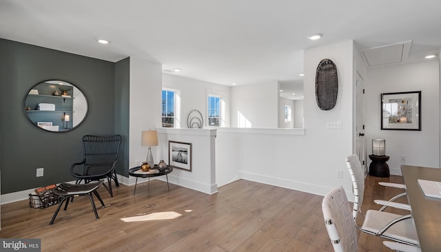 living area with hardwood / wood-style flooring