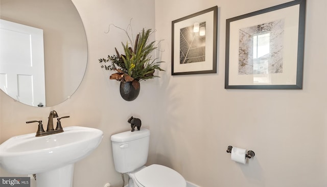 bathroom with toilet and sink