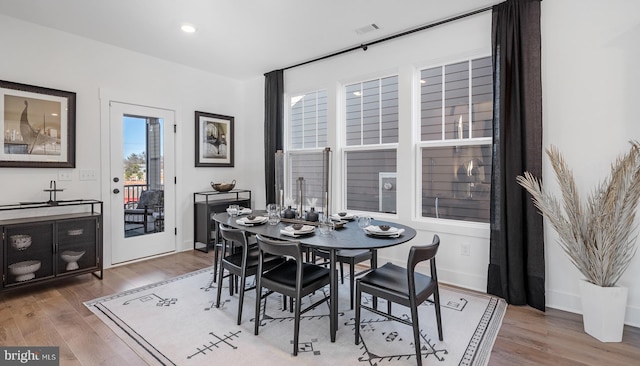 dining space with dark wood-type flooring