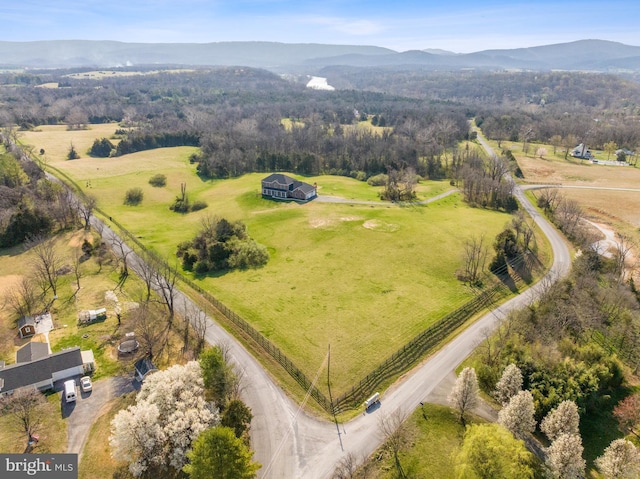 drone / aerial view with a mountain view and a rural view