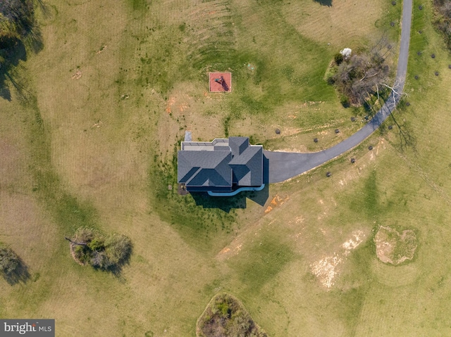 birds eye view of property with a rural view