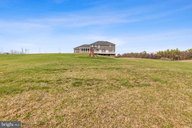 view of yard with a deck and a rural view