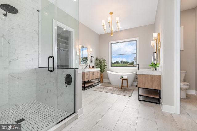 bathroom featuring a shower stall, a chandelier, toilet, a soaking tub, and vanity