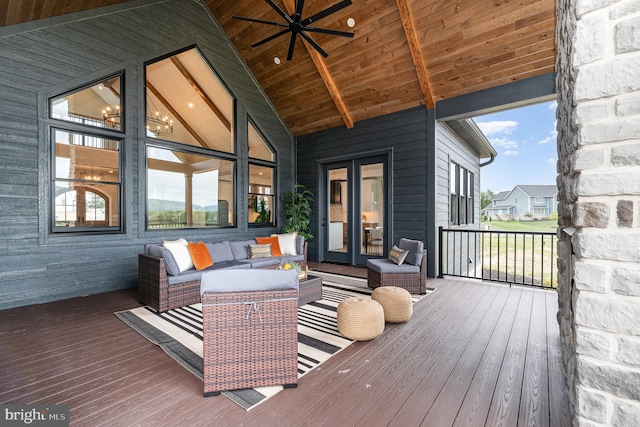 wooden terrace with an outdoor hangout area and ceiling fan