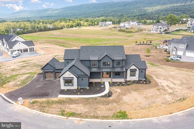 birds eye view of property with a view of trees