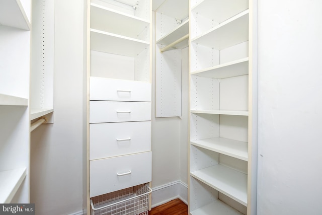 walk in closet featuring hardwood / wood-style flooring