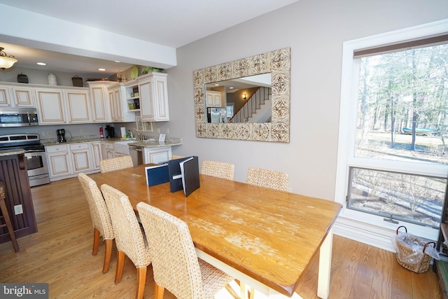 dining area with light hardwood / wood-style floors