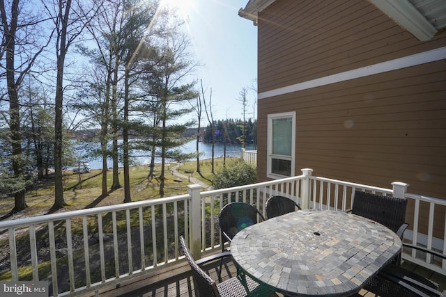 balcony with a deck with water view