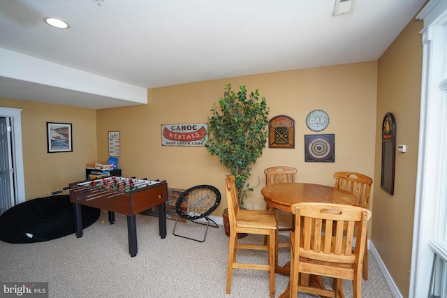 dining room featuring carpet