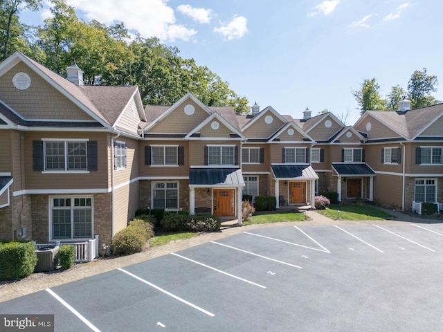 view of property featuring central AC unit