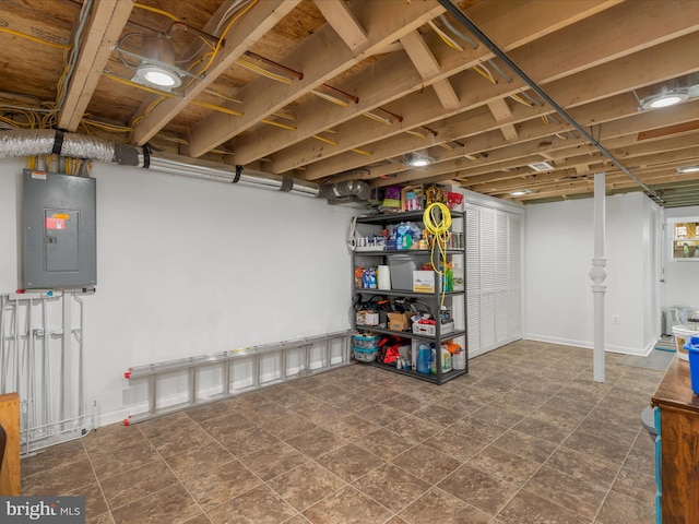 basement featuring dark tile floors