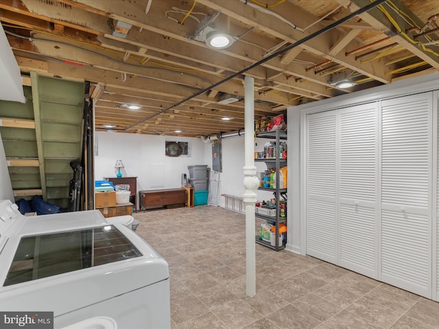 basement with independent washer and dryer and light tile flooring