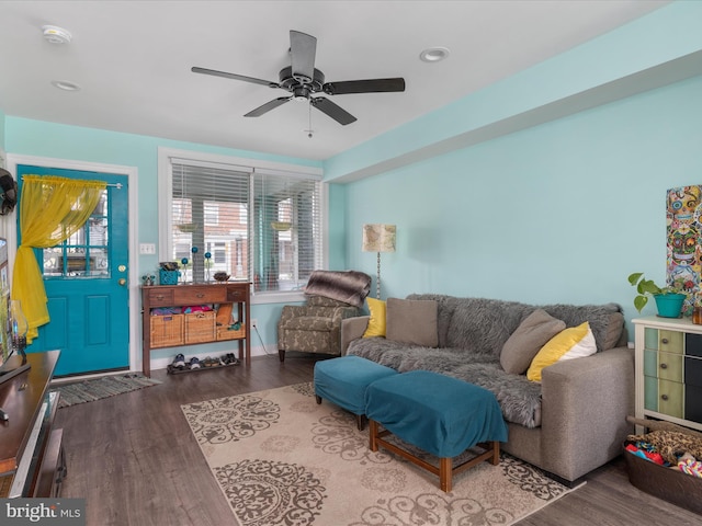 living room with ceiling fan and hardwood / wood-style floors