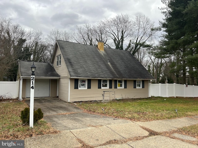 cape cod house with a front lawn and a garage