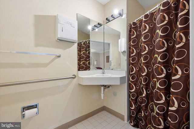 bathroom with tile flooring