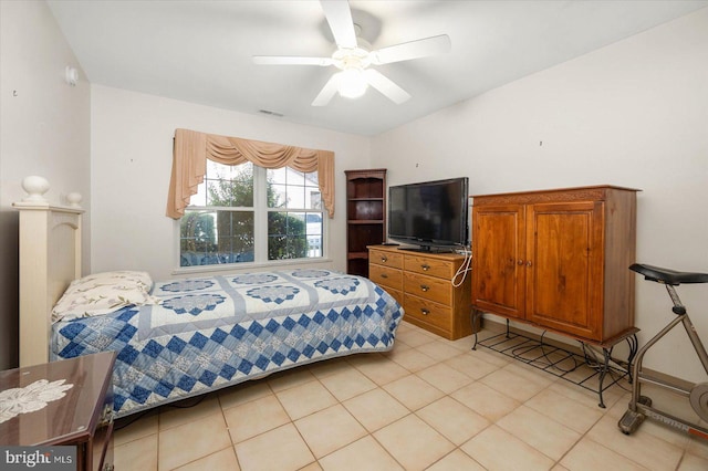 bedroom featuring ceiling fan and light tile floors