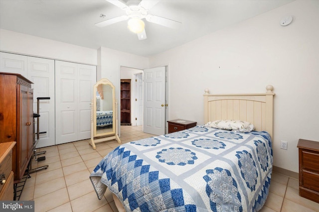 tiled bedroom featuring a closet and ceiling fan