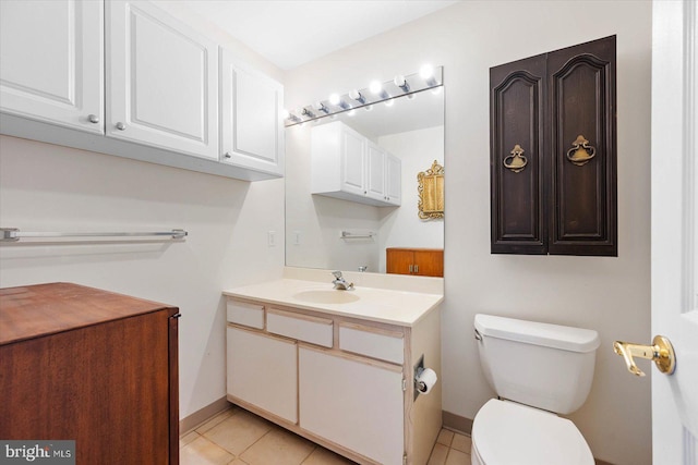 bathroom featuring tile flooring, toilet, and large vanity