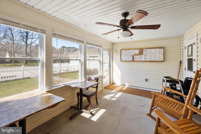 sunroom featuring ceiling fan