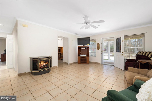 tiled living room featuring ceiling fan and crown molding