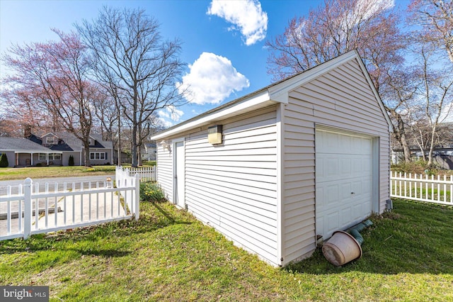 garage featuring a yard