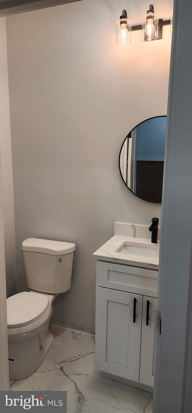 bathroom with vanity and toilet