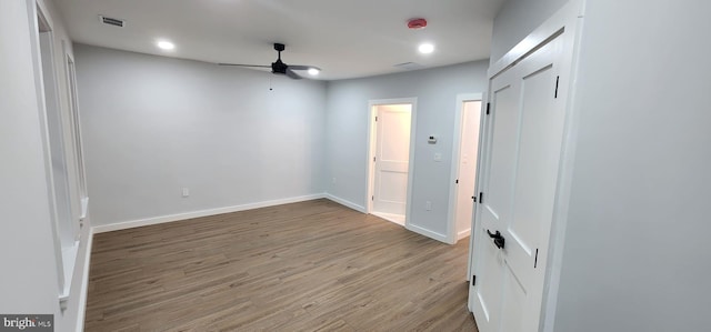 unfurnished room featuring ceiling fan and hardwood / wood-style flooring