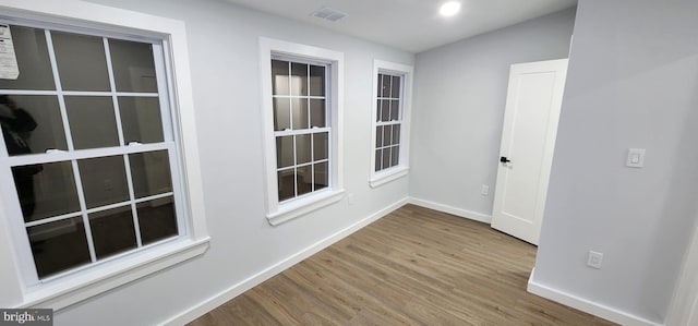 unfurnished room featuring wood-type flooring