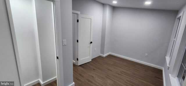 hallway featuring dark hardwood / wood-style floors