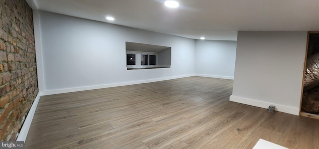 unfurnished living room with hardwood / wood-style floors