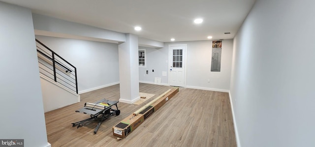 exercise room featuring light hardwood / wood-style flooring