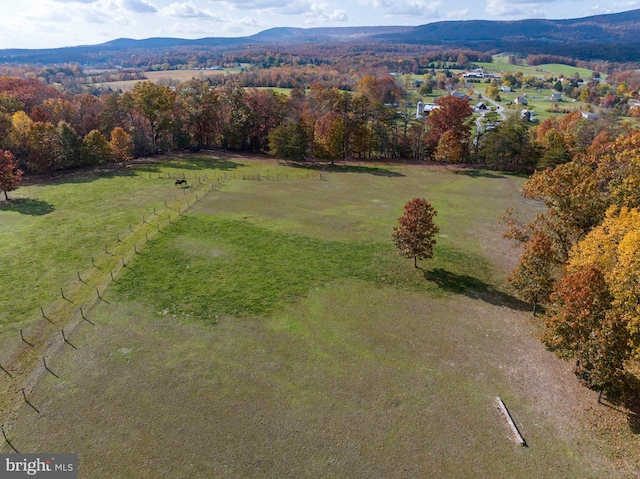 drone / aerial view featuring a mountain view and a rural view