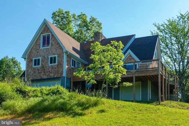 back of house with a wooden deck