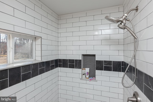 bathroom with tiled shower