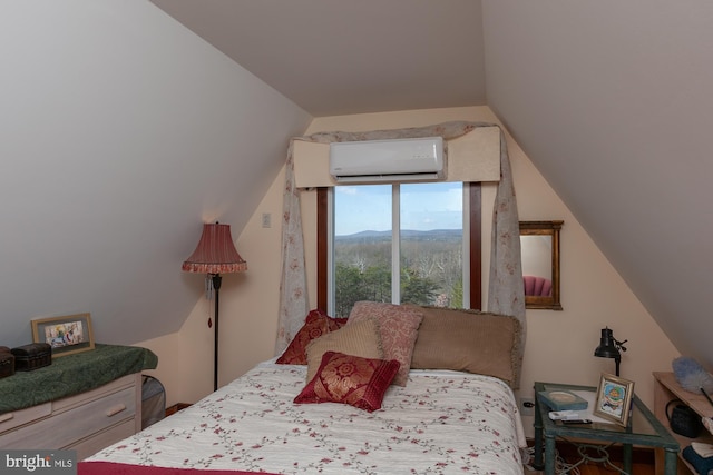 bedroom with a wall mounted air conditioner, a mountain view, and vaulted ceiling