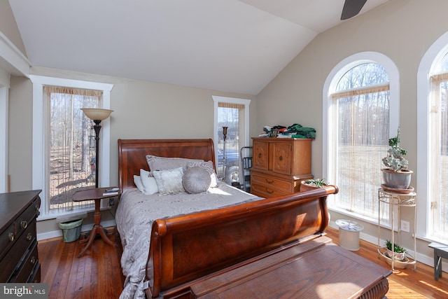 bedroom featuring ceiling fan, vaulted ceiling, and hardwood / wood-style flooring