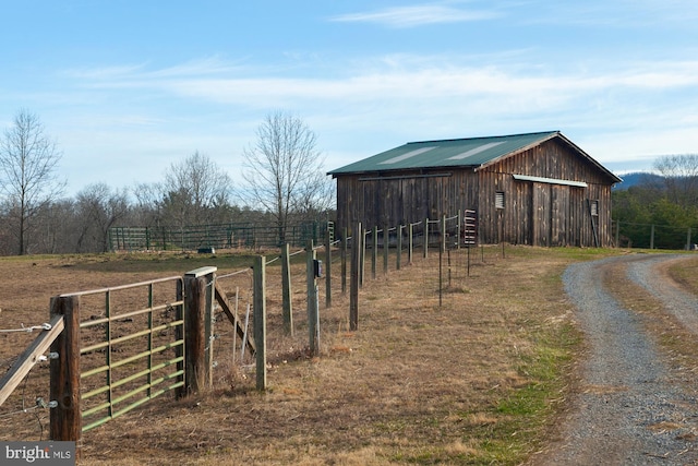 view of outbuilding featuring a rural view