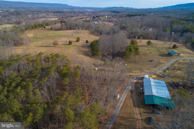 birds eye view of property featuring a mountain view and a rural view