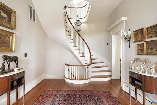 stairs featuring hardwood / wood-style flooring