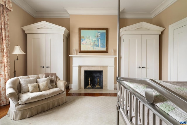 bedroom featuring light wood-type flooring and ornamental molding