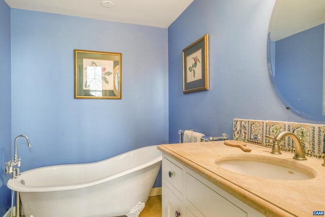 bathroom featuring vanity and a bath