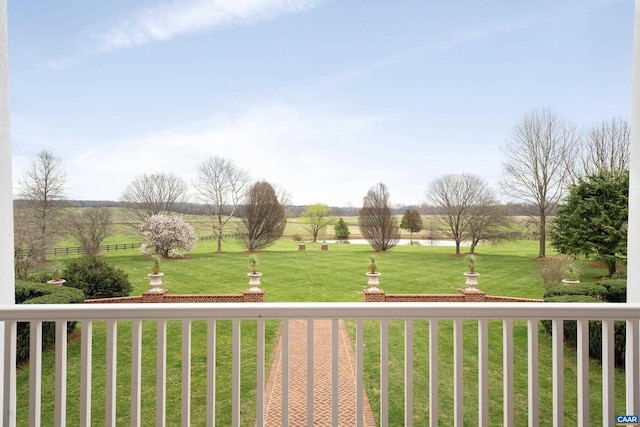 view of yard with a rural view