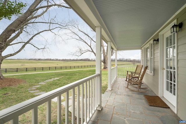 balcony with a porch and a rural view