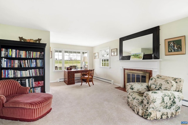 carpeted office space featuring a fireplace and a baseboard radiator