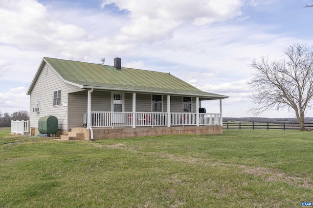 view of front of home featuring covered porch and a front yard