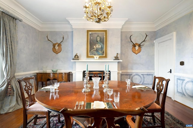 dining room with wood-type flooring, crown molding, and an inviting chandelier