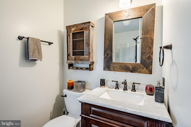 bathroom featuring toilet and oversized vanity