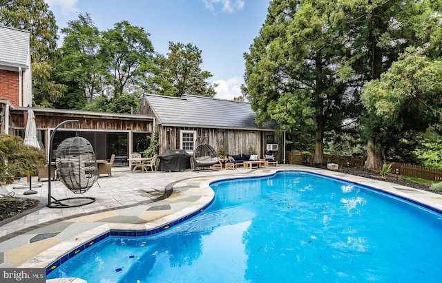 view of pool featuring an outdoor hangout area, a patio, and a grill